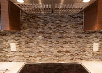 Custom kitchen with glass backsplash