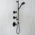 closeup of black shower and bath fixtures