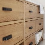 extreme closeup of ash vanity storage compartments and drawers