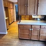 Removing the upper cabinets provided a clear line of sight and really opened up the kitchen area