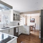 A gorgeous cooktop and hood fan complete the look.